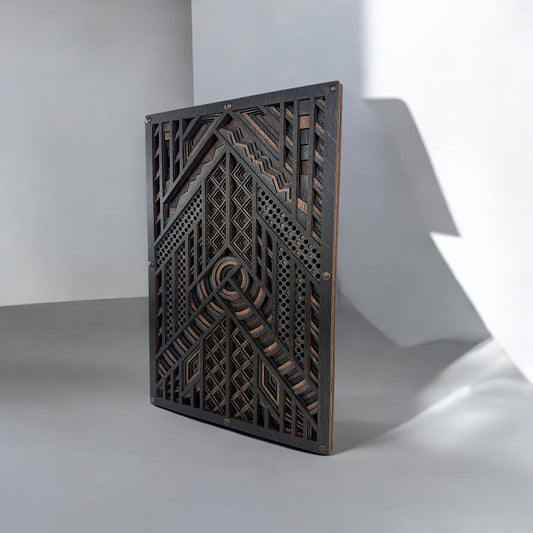 Angled view of a six-layer laser-cut wood wall art piece featuring intricate geometric patterns in dark-stained Baltic Birch, set against a neutral gray background with dramatic shadows.