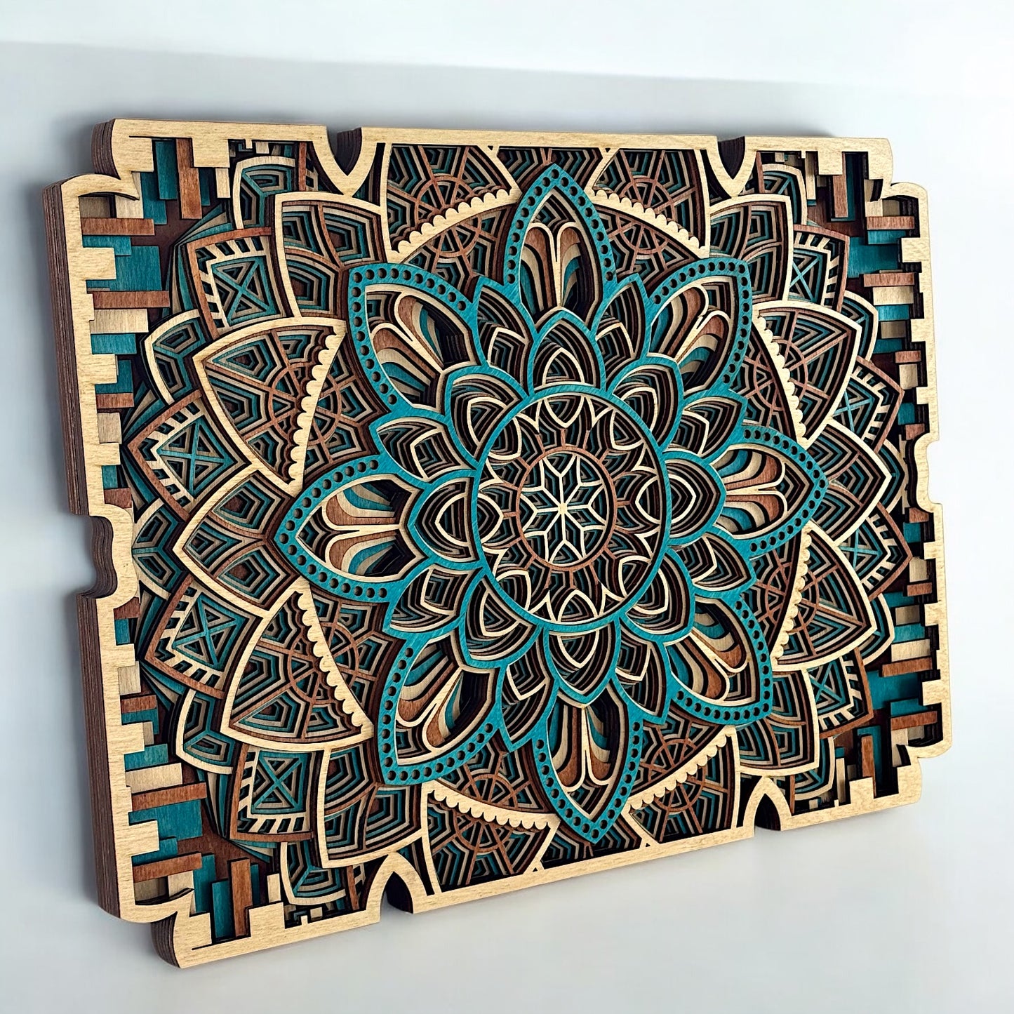 Diagonal view emphasizing the contrast between teal accents and natural wood layers, with crisp laser-cut symmetry.