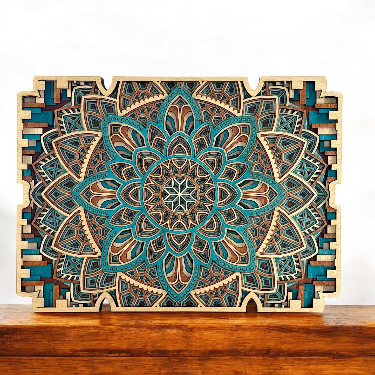 Flora Mechanica displayed on a wooden surface, showcasing its vibrant mandala center and stylized border cutouts.