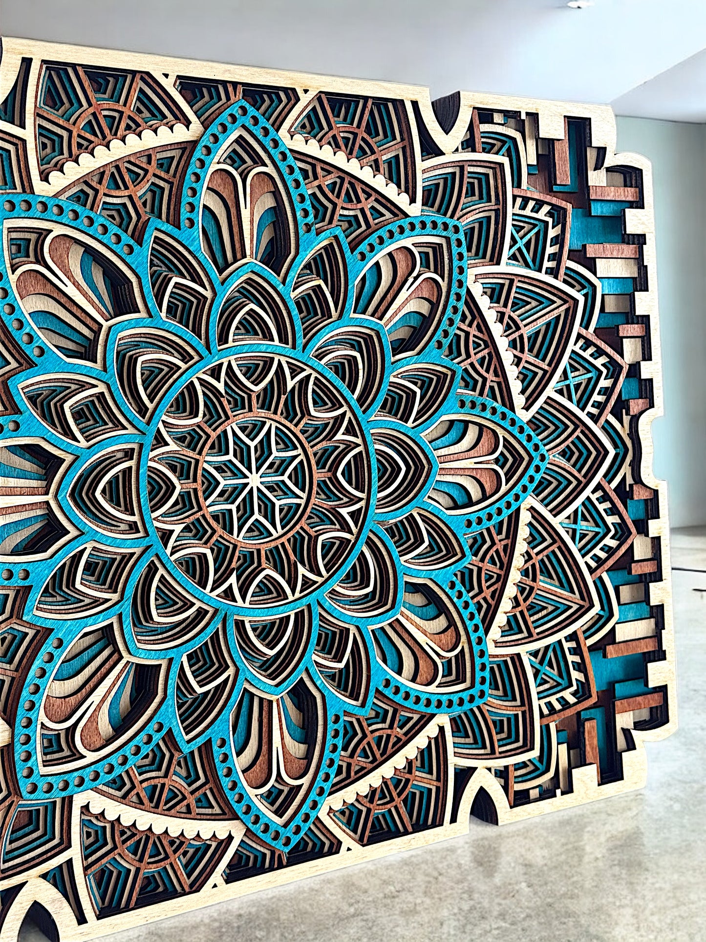 Close-up perspective from the bottom left, highlighting the layered lotus-like petals and mosaic-inspired frame.