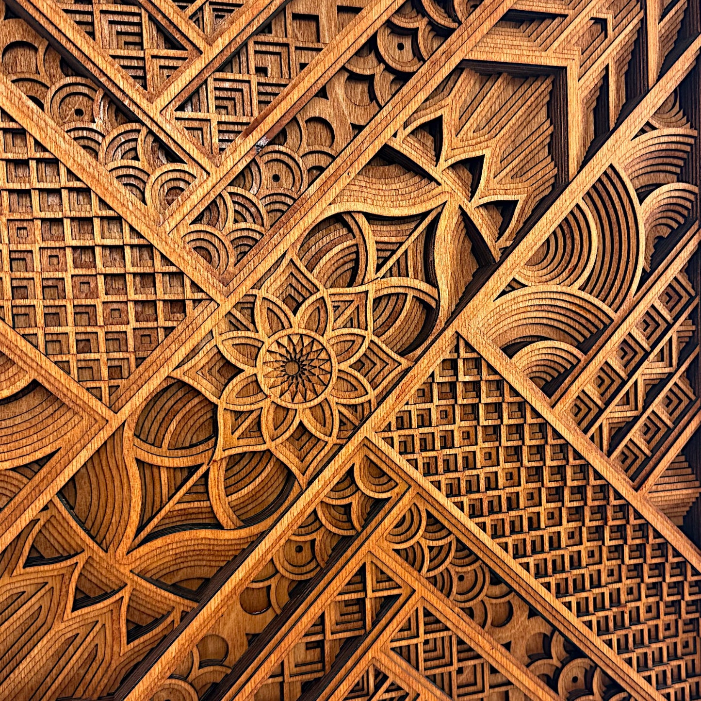 Close-up center view focusing on the mandala flower and surrounding layered geometry, showing detailed craftsmanship.