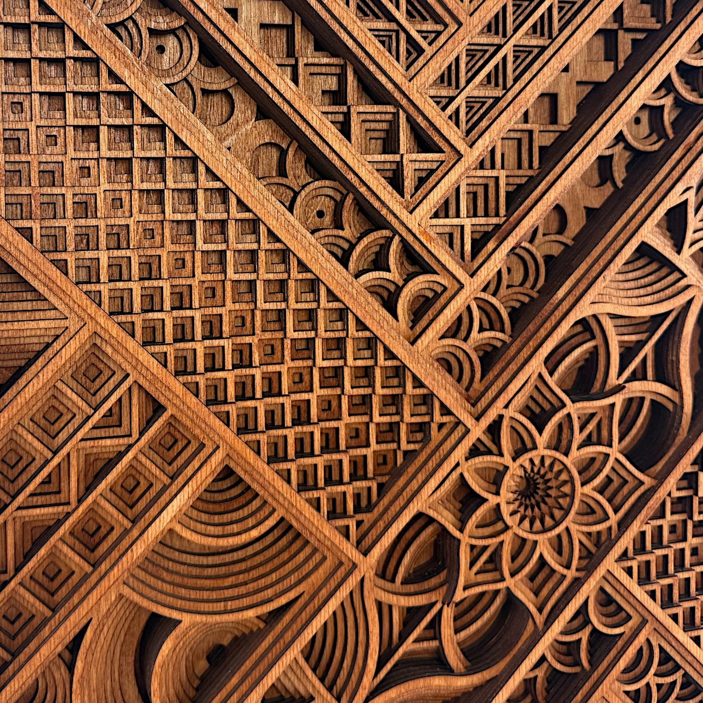 Close-up of upper-left quadrant, capturing intersecting grid patterns, curves, and intricate cutouts in the layered wood.