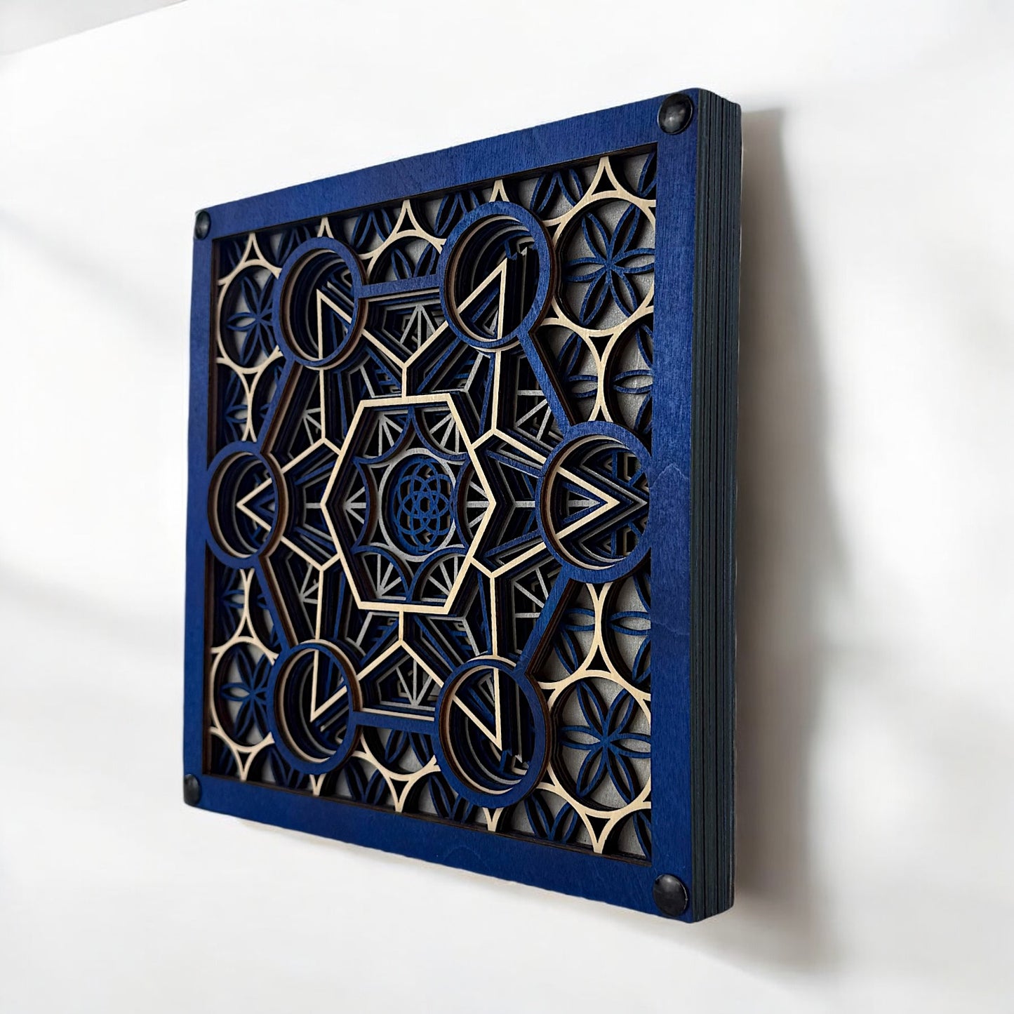 Three-quarter angle of "Metatron Ascend" showing dimensional layers and precise laser-cut detailing.