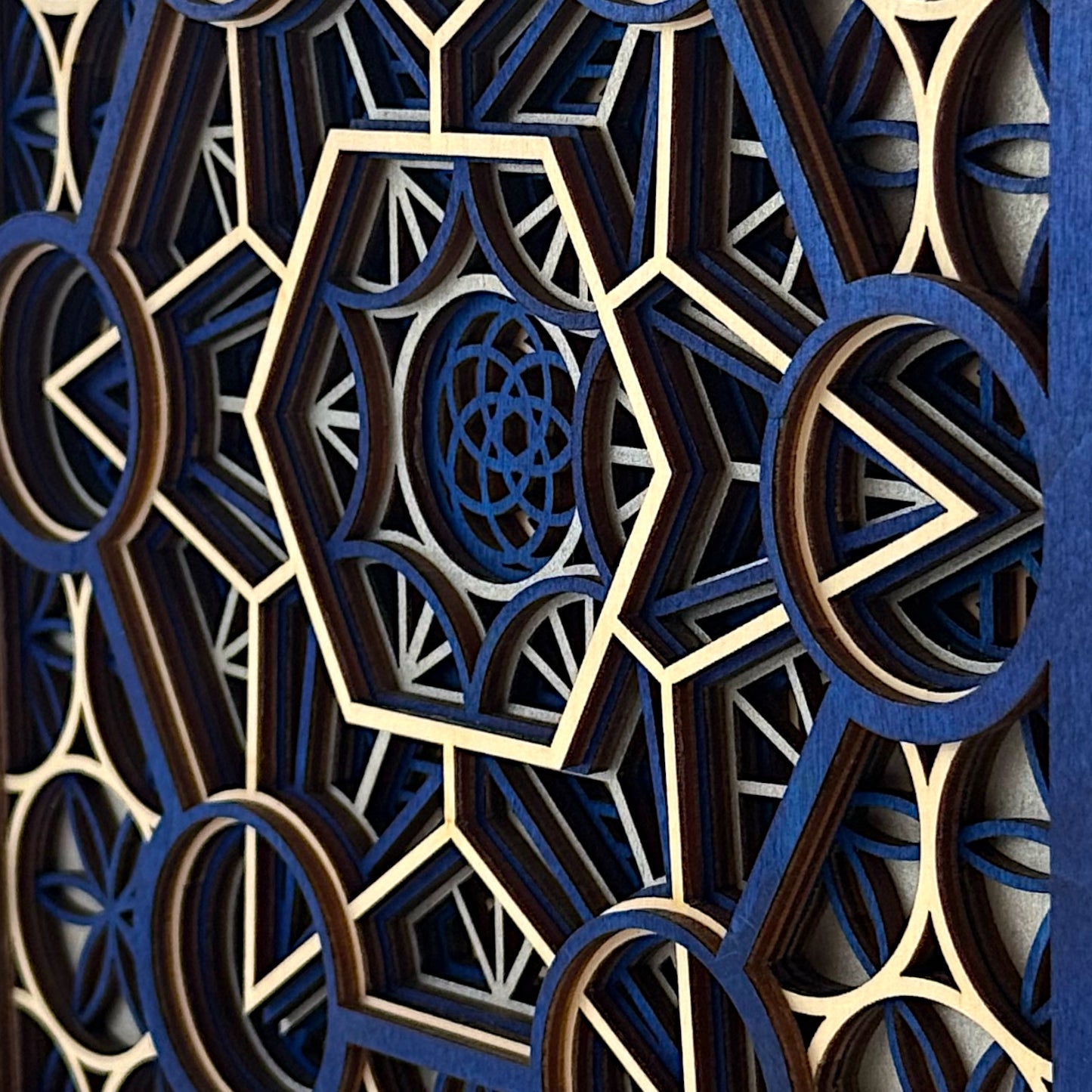 Extreme angle close-up of "Metatron Ascend" focusing on layered wood textures and interlocking sacred geometric shapes.