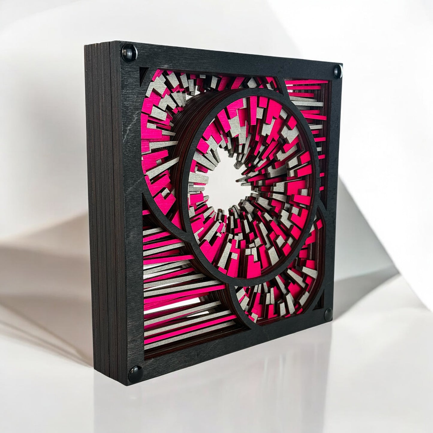 Three-quarter view of the freestanding wood sculpture, emphasizing its structural thickness and radiant burst design.