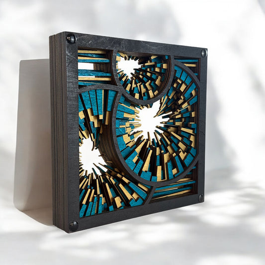 Side angle of Metrorhythm V3 highlighting the depth of laser-cut layers in teal and metallic gold wood with bold radial patterns.