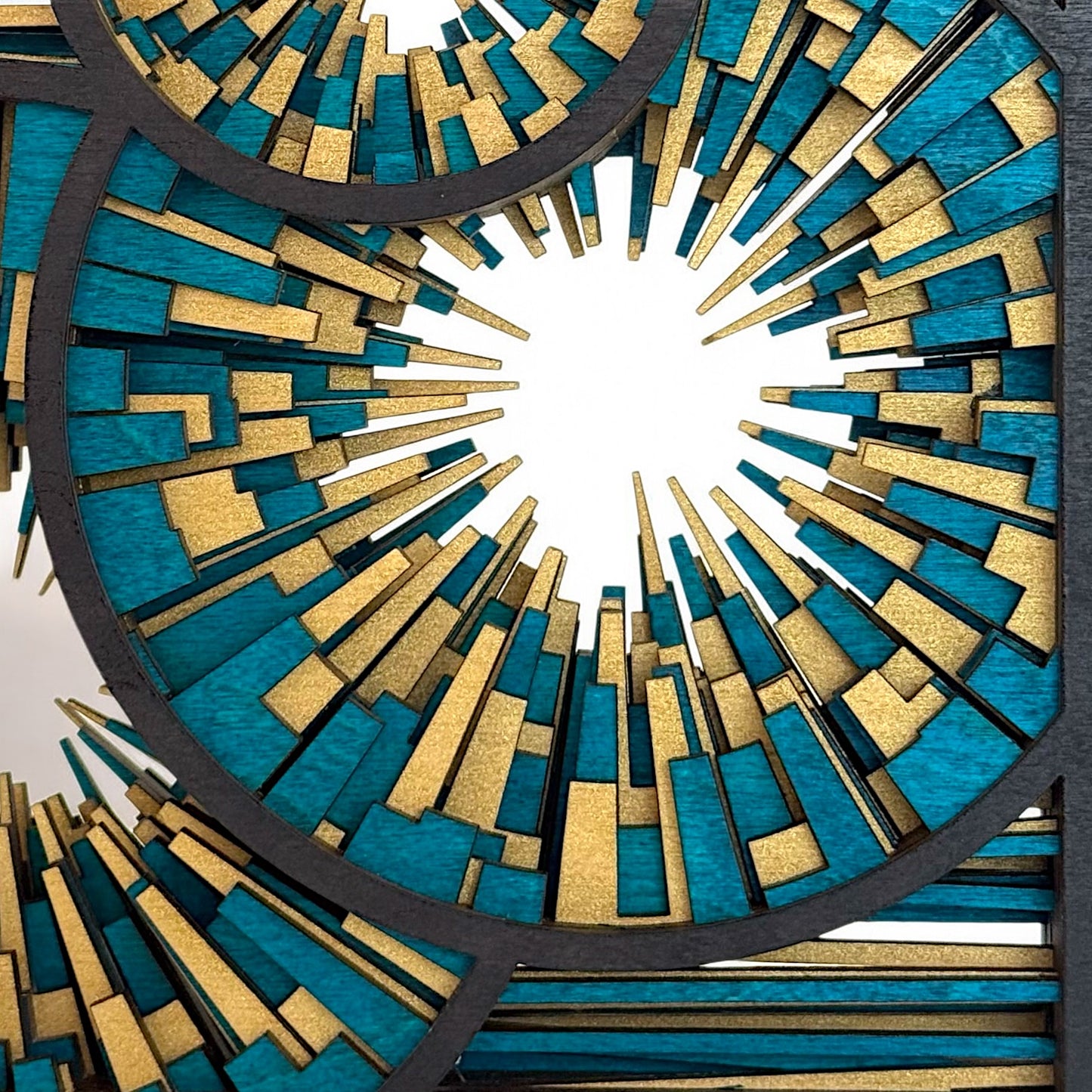 Zoomed-in view of the central geometric burst in Metrorhythm V3, showcasing precision cuts and color layering.