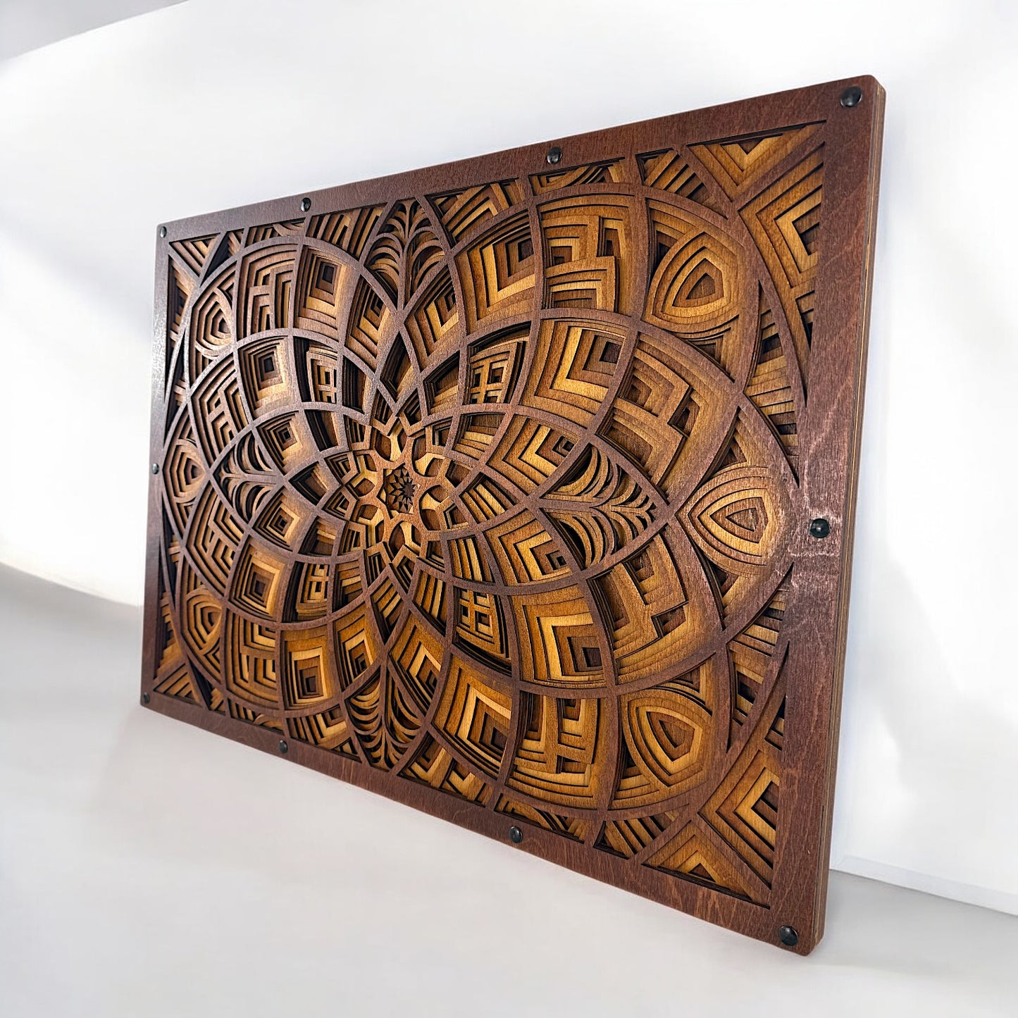 Angled photo capturing the Petal Maze artwork's deep-cut detailing and rich, dyed wood layers.