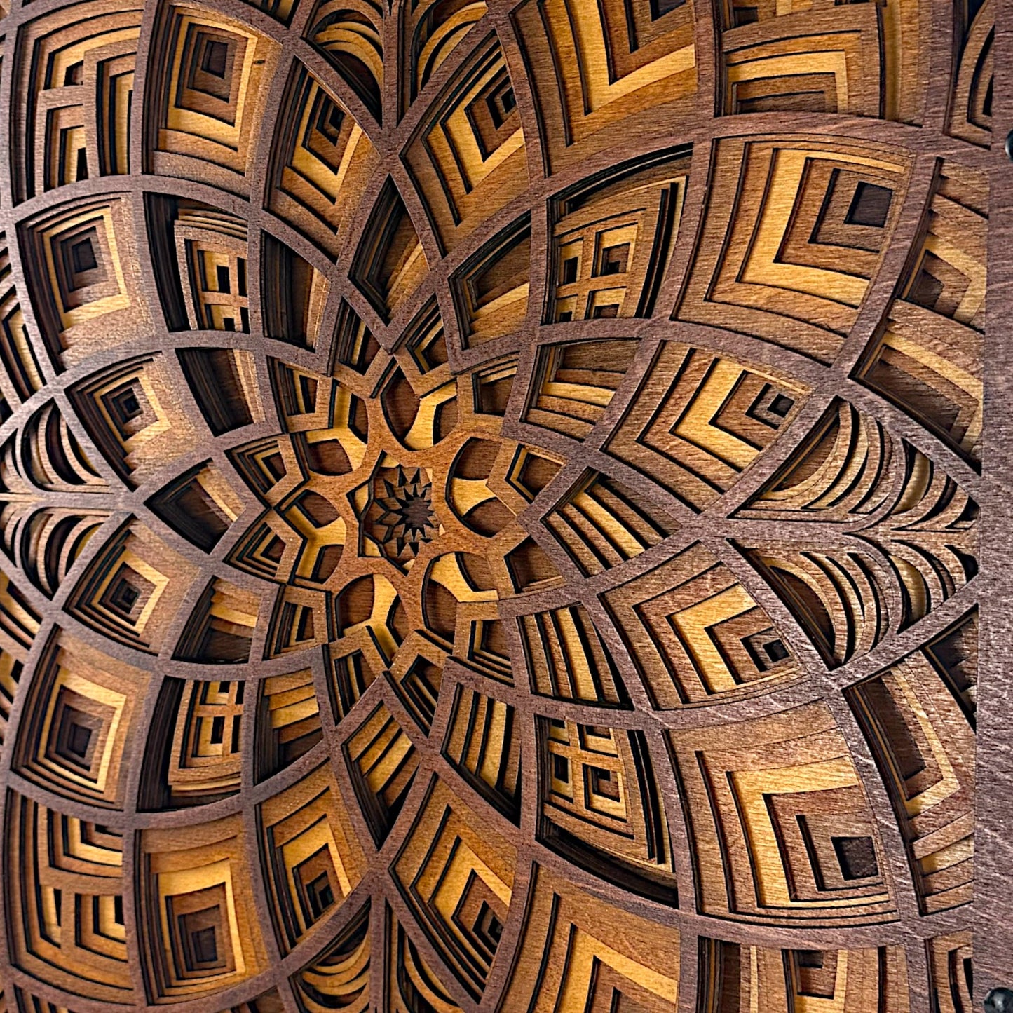 Extreme close-up view showcasing the fine-cut pattern and three-dimensional layering within the wood design.