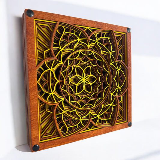 Angled side view with sunlight – Laser-cut wood artwork showcasing layered floral geometry with deep shadows and vibrant yellow highlights on a white background.