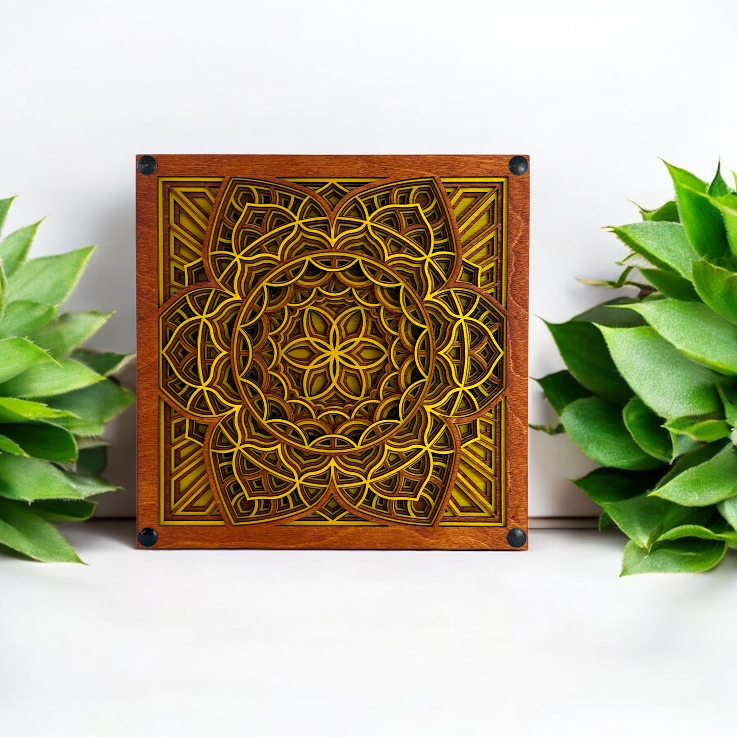 Quantum Blossom with plants – Centered wall art surrounded by greenery, emphasizing the natural and sacred geometry aesthetic of the yellow and wood-toned mandala.