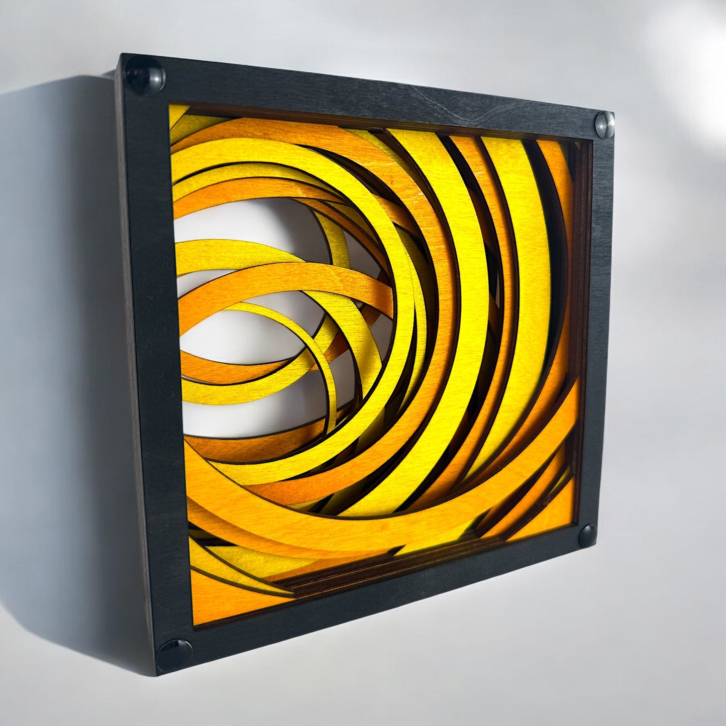Side perspective of Radiant Drift geometric wall sculpture, capturing overlapping curved layers in rich yellow and amber tones.