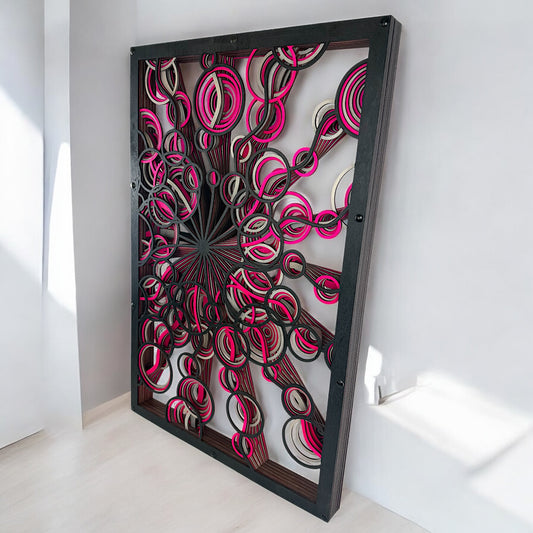 Left-angled side view of the layered wood art leaning against a white wall, emphasizing the depth and 3D effect of the spiral design.