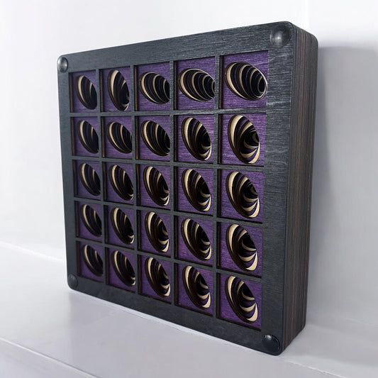 Angled side view of Vortex Array laser-cut wood artwork showing depth and dimensional layers in each geometric vortex square.