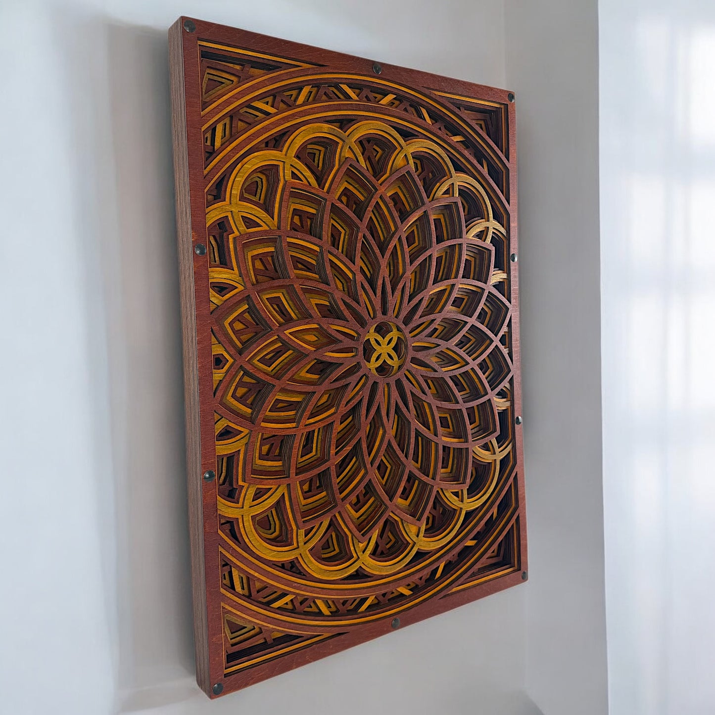 Vortex Blossom wall art displayed vertically in a softly lit corner, highlighting its detailed mandala geometry.
