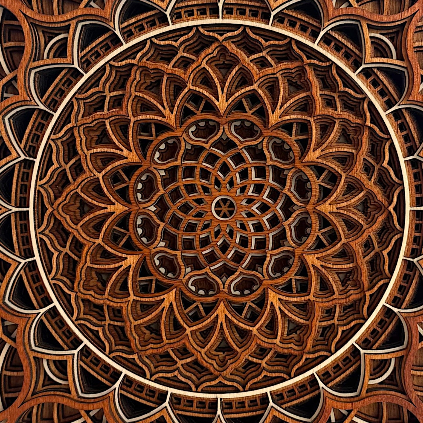 Close-up of the center of the Vortex Reliquary, emphasizing the radial symmetry and fine craftsmanship of the wood layers.