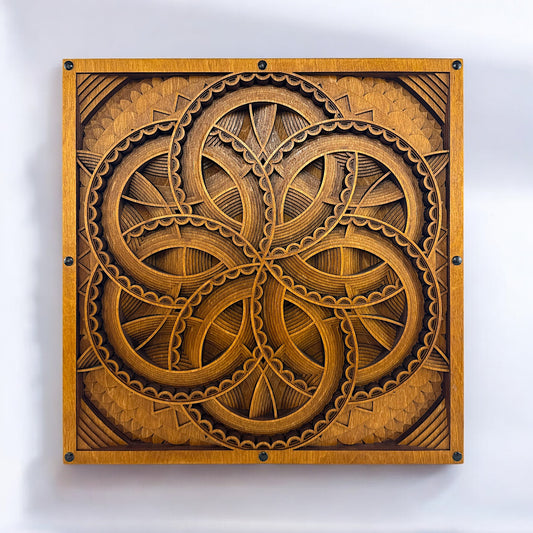 Front-facing view of Axis Reverie, a 10-layer laser-cut geometric wood art piece with interwoven circular patterns and a warm, golden-brown finish.