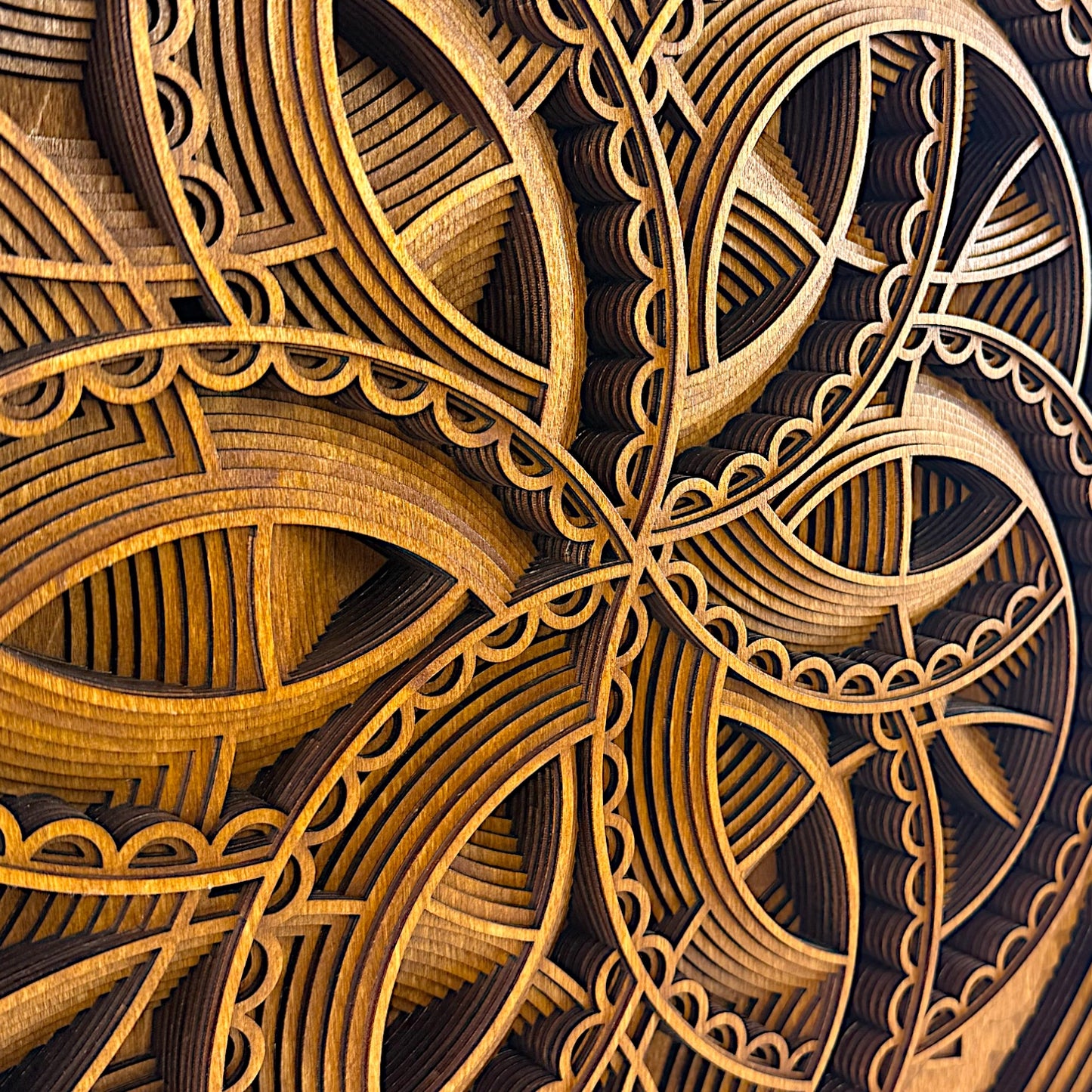 Macro view of the interlocked curves and scalloped edges in the Axis Reverie design, showcasing the depth and craftsmanship.