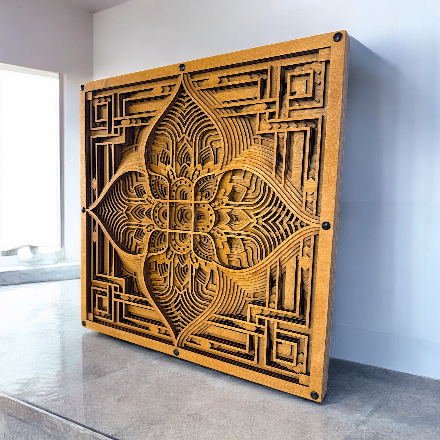 Driftpetal wood art positioned near a sunlit window, casting soft shadows that enhance the layering and organic-meets-digital pattern.