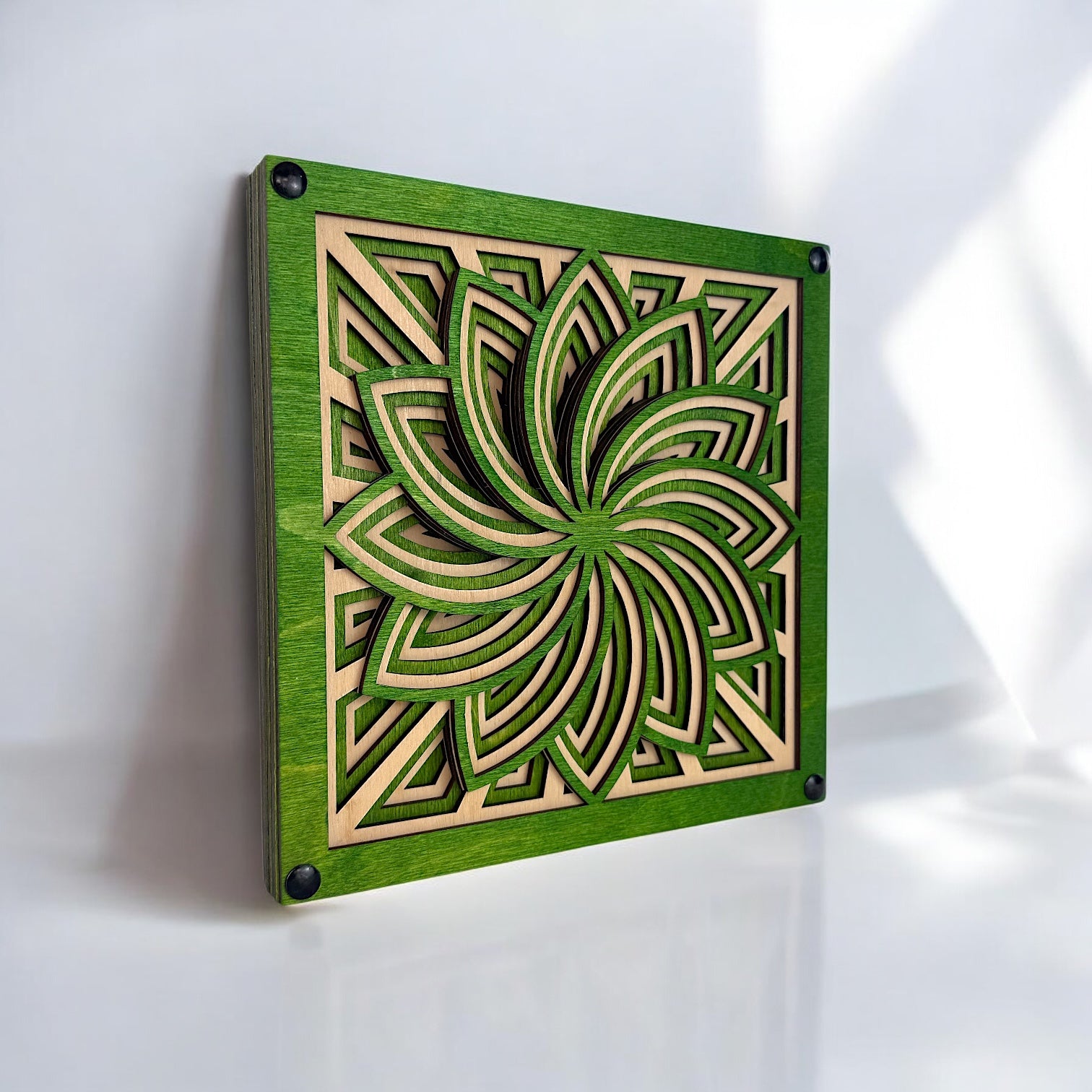 Three-quarter perspective of the freestanding Floraspiral piece, highlighting its petal-like forms and layered symmetry.