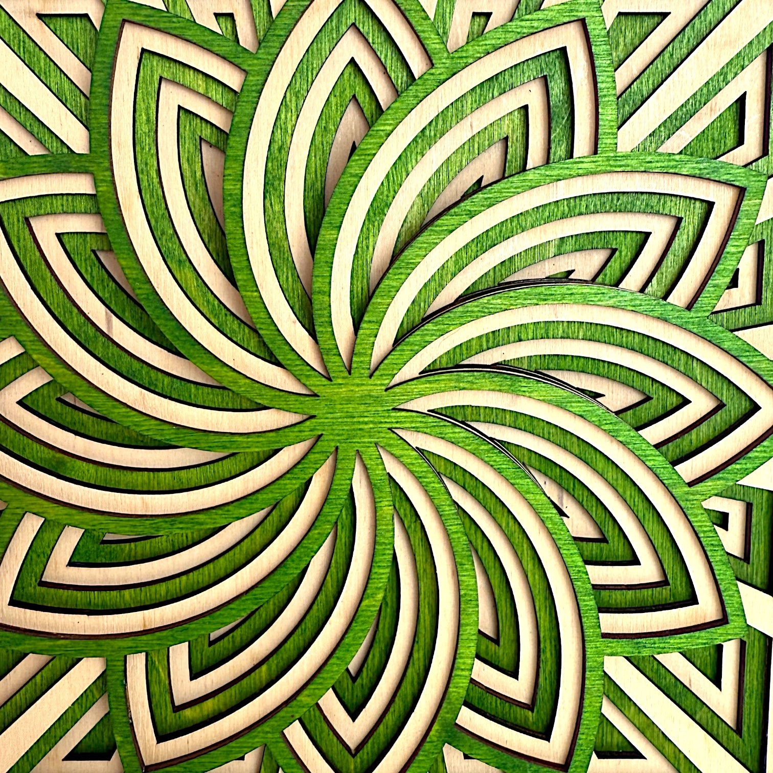 Macro detail of Floraspiral’s floral spiral pattern, showcasing intricate layering and smooth natural wood grain.