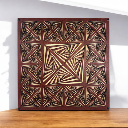 Square display of the Kaleidocore piece positioned on a wooden surface, showcasing its dynamic pattern and handcrafted detail.