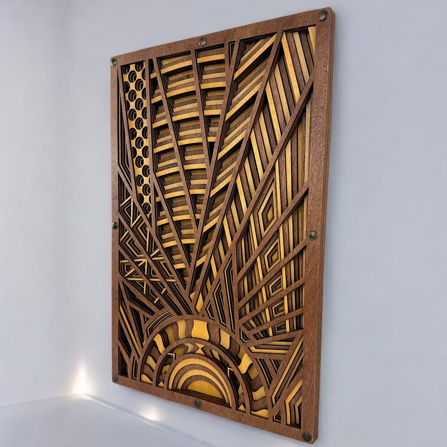 Angled close-up of layered Baltic Birch wood art showing laser-cut detail and dimensional depth