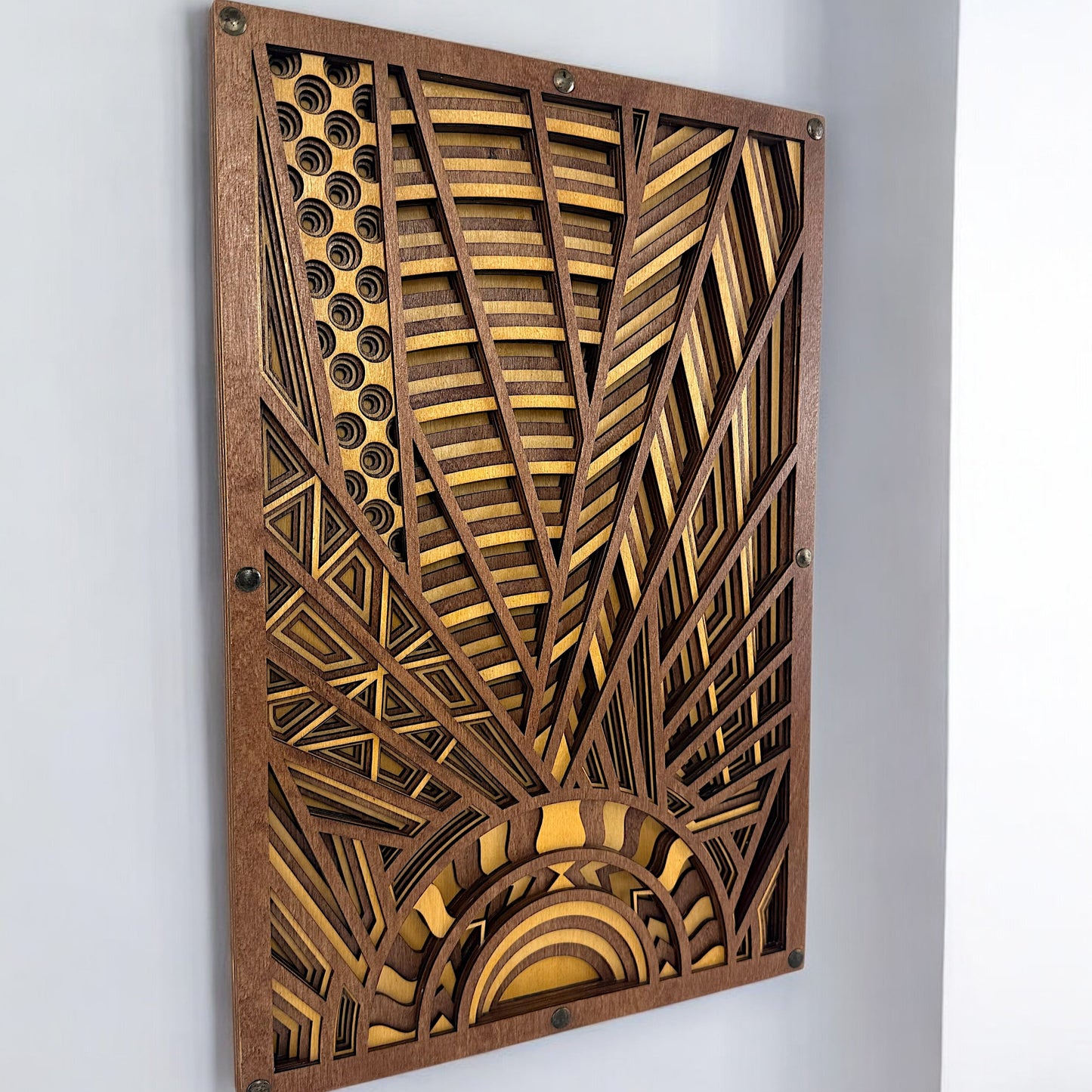 Angled close-up of layered Baltic Birch wood art showing laser-cut detail and dimensional depth