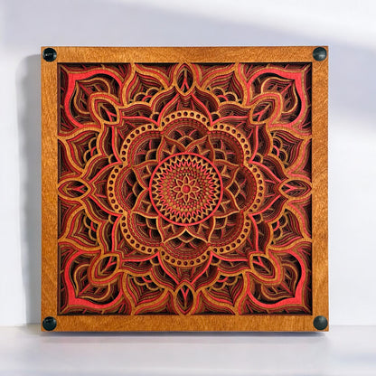 Front-facing view of Temple Bloom laser-cut wood art, showcasing intricate 12-layer mandala design in warm red, gold, and brown tones.