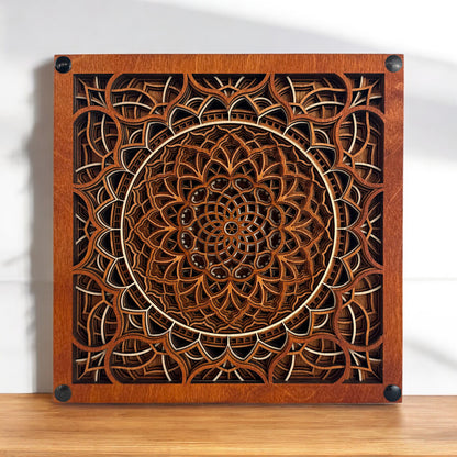 Vortex Reliquary displayed flat on a tabletop with soft sunlight, revealing its symmetrical and ornate wooden pattern.