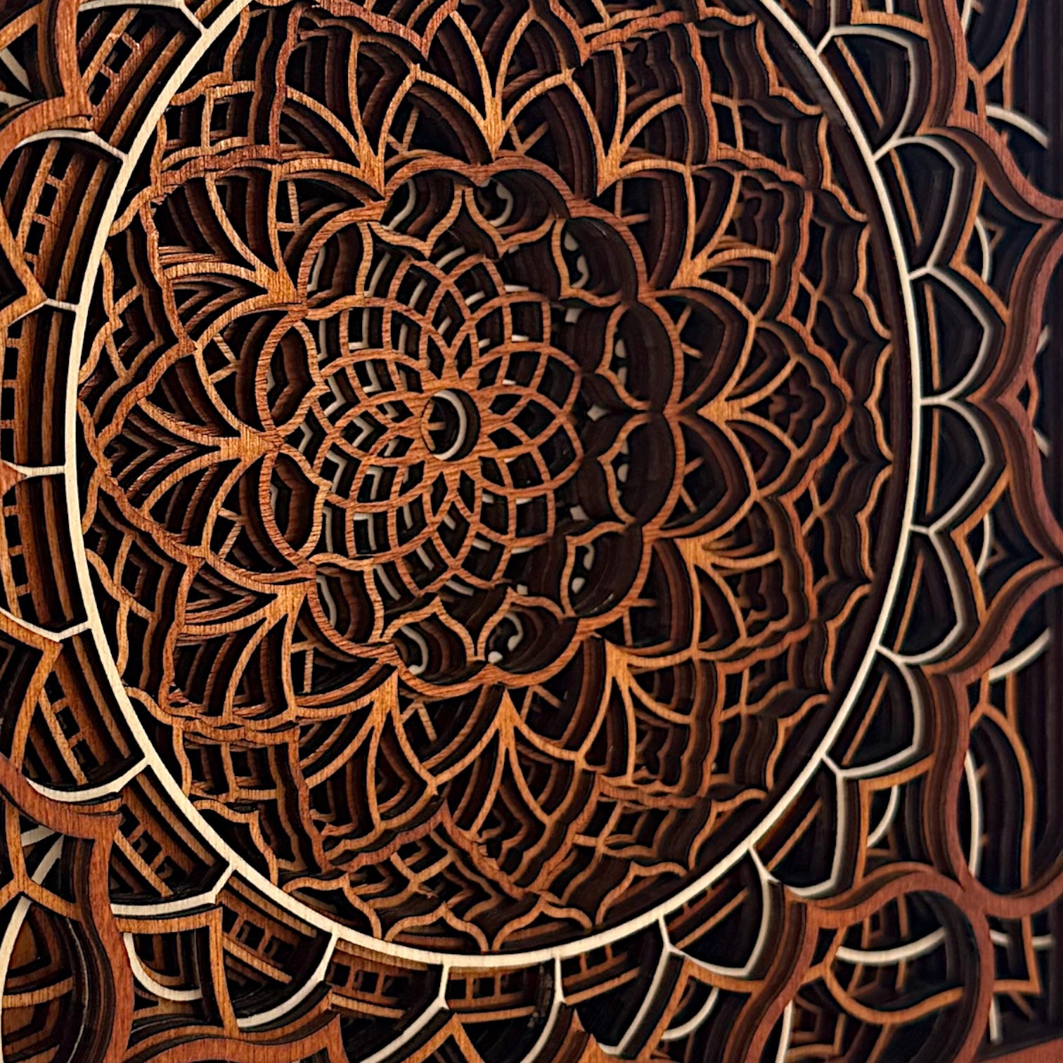 Macro side detail of Vortex Reliquary's layered structure, showing the interplay of light and shadow through intricate cuts.